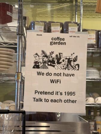 Picture of a Sign that reads "We do no have Wifi. Pretend it's 1995. Talk to each other"
